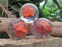 Polished Red Jasper cobbed piece in PVC Resin Sphere - sold per item - From South Africa