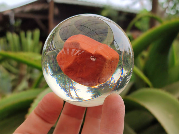 Polished Red Jasper cobbed piece in PVC Resin Sphere - sold per item - From South Africa