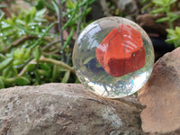 Polished Red Jasper cobbed piece in PVC Resin Sphere - sold per item - From South Africa