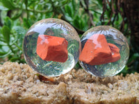 Polished Red Jasper cobbed piece in PVC Resin Sphere - sold per item - From South Africa