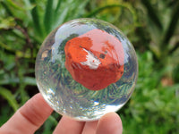 Polished Red Jasper cobbed piece in PVC Resin Sphere - sold per item - From South Africa