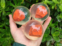 Polished Red Jasper cobbed piece in PVC Resin Sphere - sold per item - From South Africa