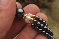 Polished Hematite and Freshwater Pearl Twisted Beaded Necklace - Sold Per Item - From Southern Africa