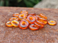 Polished Box of Fossilized Baltic Amber Donut Rings for Pendants x 39 From Poland