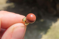 Polished Pair of Copper Sunstone Stud Earrings - sold per Pair - From India