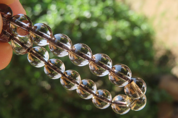 Polished Clear Smokey Quartz Beaded Stretch Bracelet - Sold Per Item - From Madagascar