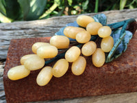 Polished Honey Aragonite Hanging Bunch of Grapes with Green Fuchsite Leaves - sold per item - From Namibia