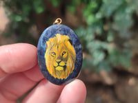 Polished Dumortierite Pendants with Hand Painted Lion - sold per item - From Mozambique