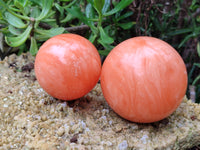 Polished Orange Twist Calcite Spheres x 2 From Madagascar