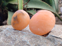 Polished Orange Twist Calcite Palm Stones x 12 From Madagascar