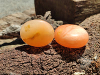 Polished Orange Twist Calcite Palm Stones x 12 From Madagascar