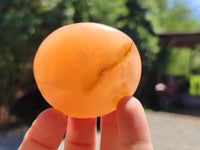 Polished Orange Twist Calcite Palm Stones x 12 From Madagascar