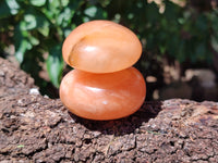 Polished Orange Twist Calcite Palm Stones x 12 From Madagascar