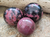 Polished Rhodonite Sphere x 3 From Ambindavato, Madagascar