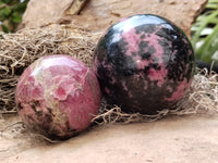 Polished Rhodonite Sphere x 3 From Ambindavato, Madagascar