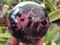 Polished Rhodonite Sphere x 3 From Ambindavato, Madagascar