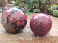 Polished Rhodonite Sphere x 3 From Ambindavato, Madagascar