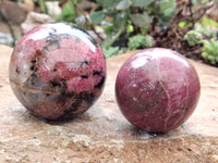 Polished Rhodonite Sphere x 3 From Ambindavato, Madagascar