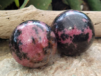 Polished Rhodonite Sphere x 3 From Ambindavato, Madagascar