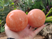 Polished Orange Twist Calcite Spheres x 2 From Maevantanana, Madagascar