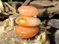 Polished Orange Twist Calcite Palm Stones x 20 From Madagascar