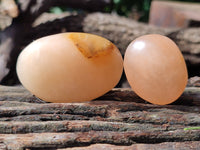 Polished Orange Twist Calcite Palm Stones x 20 From Madagascar