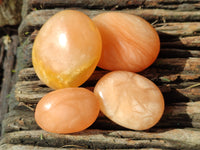 Polished Orange Twist Calcite Palm Stones x 20 From Madagascar