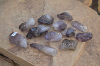 Natural Small Window Amethyst Crystals with Enhydro Bubble x 12 From Chiredzi, Zimbabwe