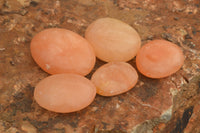 Polished Small Orange Twist Calcite Gallets / Palm Stones - sold per 1 kg - From Maevantanana, Madagascar - TopRock