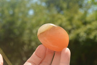 Polished Small Orange Twist Calcite Gallets / Palm Stones - sold per 1 kg - From Maevantanana, Madagascar - TopRock