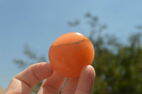 Polished Small Orange Twist Calcite Gallets / Palm Stones - sold per 1 kg - From Maevantanana, Madagascar - TopRock