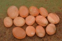 Polished Small Orange Twist Calcite Gallets / Palm Stones - sold per 1 kg - From Maevantanana, Madagascar - TopRock