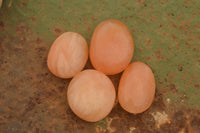 Polished Small Orange Twist Calcite Gallets / Palm Stones - sold per 1 kg - From Maevantanana, Madagascar - TopRock