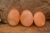 Polished Small Orange Twist Calcite Gallets / Palm Stones - sold per 1 kg - From Maevantanana, Madagascar - TopRock