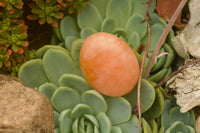 Polished Small Orange Twist Calcite Gallets / Palm Stones - sold per 1 kg - From Maevantanana, Madagascar - TopRock