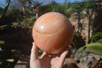 Polished Large Orange Twist Calcite Sphere x 1 From Maevantanana, Madagascar