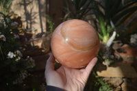 Polished Large Orange Twist Calcite Sphere x 1 From Maevantanana, Madagascar