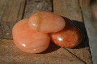 Polished Orange Twist Calcite Palm Stones  x 14 From Madagascar - Toprock Gemstones and Minerals 