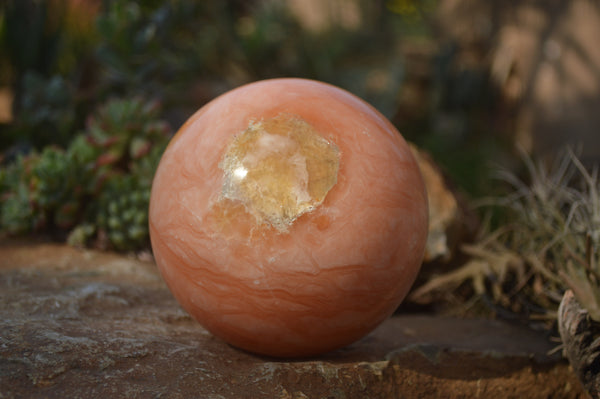 Polished Orange Twist Calcite Sphere x 1 From Maevantanana, Madagascar