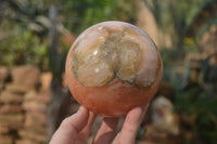 Polished Orange Twist Calcite Sphere x 1 From Maevantanana, Madagascar