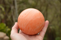 Polished Vibrant Orange Twist Calcite Sphere x 1 From Madagascar - TopRock