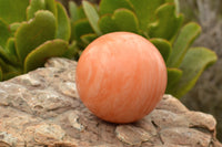 Polished Vibrant Orange Twist Calcite Sphere x 1 From Madagascar - TopRock