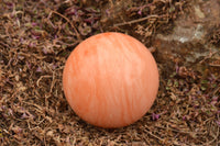 Polished Vibrant Orange Twist Calcite Sphere x 1 From Madagascar - TopRock