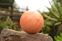 Polished Vibrant Orange Twist Calcite Sphere x 1 From Madagascar - TopRock