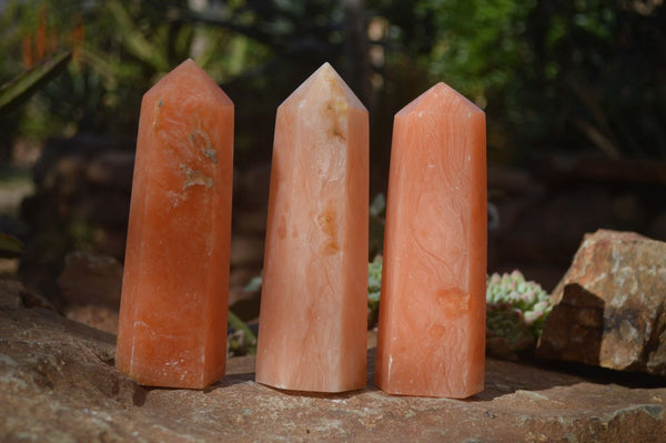 Polished Orange Twist Calcite Points x 3 From Maevantanana, Madagascar