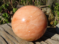 Polished Orange Twist Calcite Sphere x 1 From Maevantanana, Madagascar