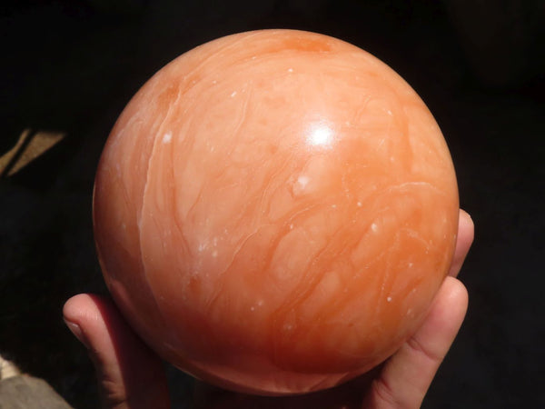 Polished Orange Twist Calcite Sphere x 1 From Maevantanana, Madagascar