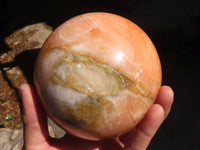 Polished Orange Twist Calcite Sphere x 1 From Maevantanana, Madagascar