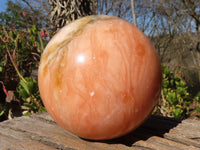 Polished Orange Twist Calcite Sphere x 1 From Maevantanana, Madagascar