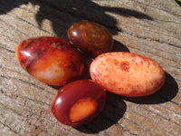 Polished Bright Red/ Orange Small to Medium Sized Carnelian Agate Palm Stones / Gallets - sold per kg - From Madagascar - TopRock